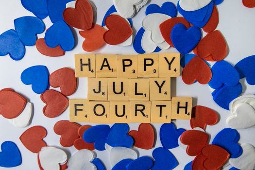 pexels-photo-6021831-6021831 Heartfelt Fourth of July message with letter tiles surrounded by colorful hearts.